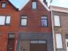 Verzorgde rijwoning  Bestaande uit:  Gelijkvloers: ruime garage, trappenhal, woonkamer, keuken, inge